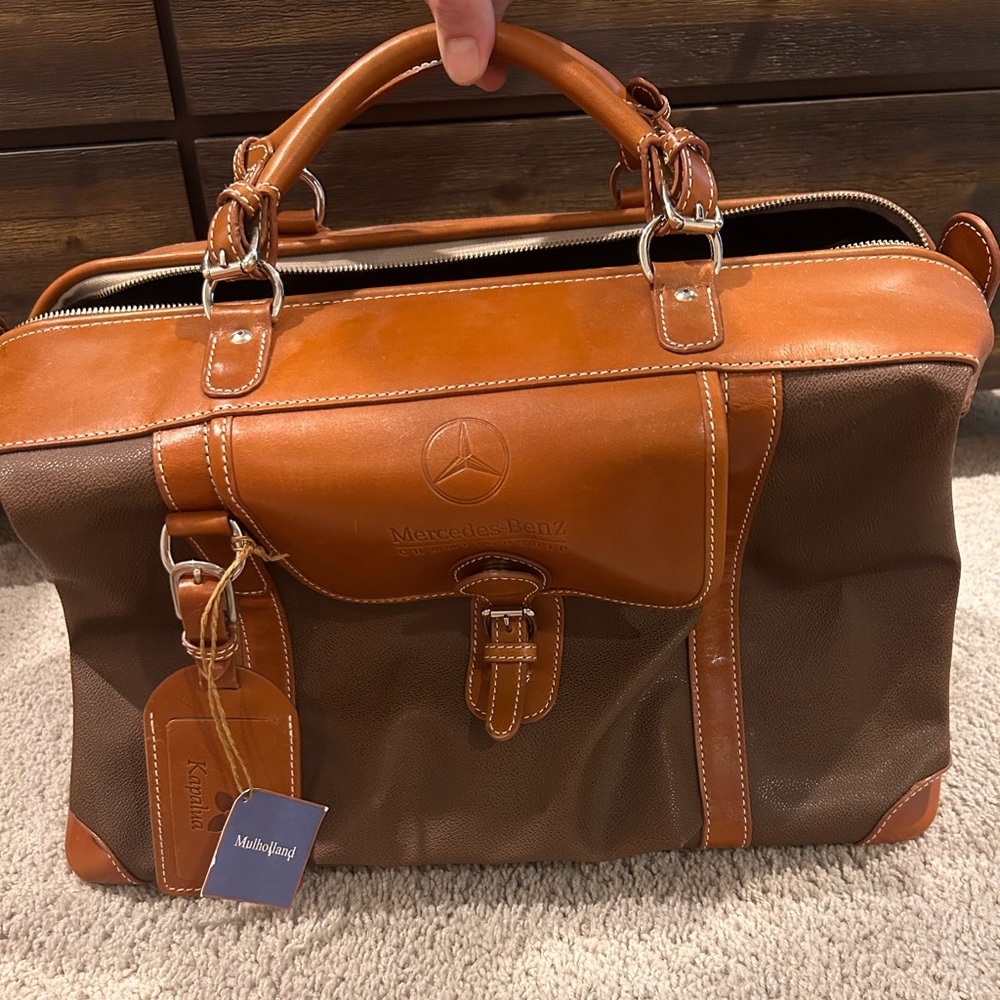 Mulholland brothers leather travel bag, Mercedes Benz logo, kapalua golf.